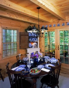 dining room table set for dinner with chandelier from tongue and groove ceiling, electrical wiring in a log home, Timberhaven Log Homes, log homes, log cabin homes, log cabins, post and beam homes, timberframe homes, timber frame homes, laminated logs, engineered logs, floor plan designs, kiln dried logs, Flury Builders, Joe Walsh, Timberhaven local reps, log homes in Massachusetts, log homes in Rhode Island, MA, RI, log home builders