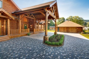 Towering Log Home Portico with Style, incorporating wood materials, custom outdoor structures, outdoor wooden structures
