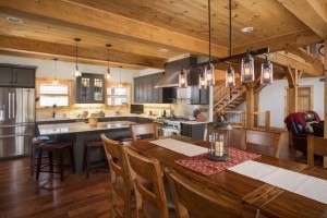 timber frame kitchen and dining area, wide open spaces, trendy tiles, log homes, timber frame homes, timber homes, Timberhaven, tiles for custom homes, Timber Frame Open Living Areas