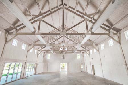 massive post and beam trusses inside building, timber truss, Glenmere Events Center, timber accents, post and beam construction, commercial projects, Timberhaven, engineered timbers, kiln dried timbers