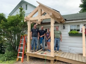group of people working on porch, pay it forward, random acts of kindness, kindness matters, RAKs, Timberhaven, community support, middleburg, PA