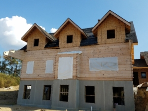 walkout basement option, log home under construction, Timberhaven, comparing log and timber home estimates